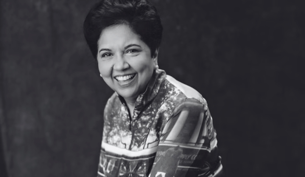 Indra Nooyi, Former CEO of Pepsi Co smiles at the camera. The image is black and white.