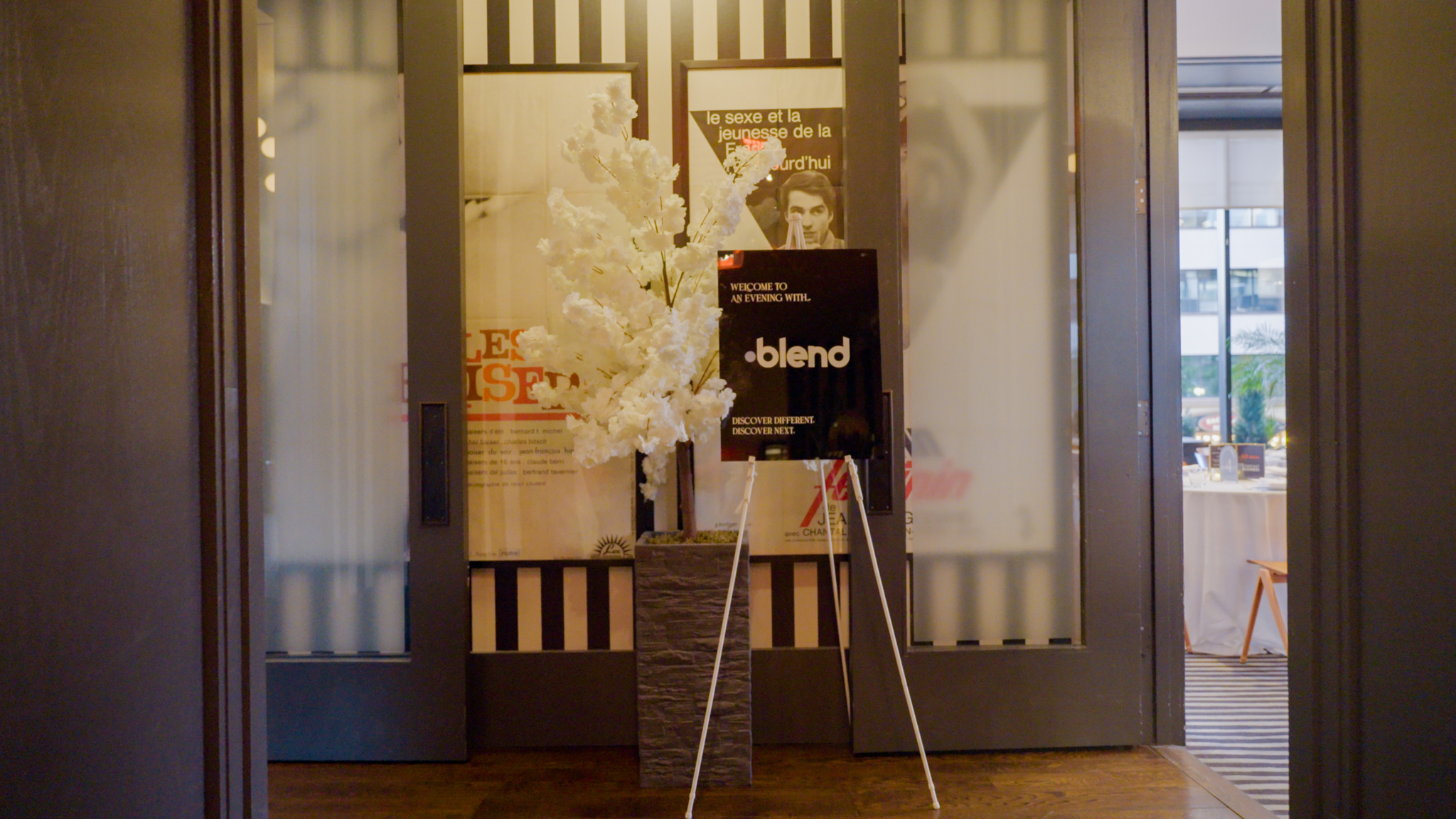 A welcome sign to a Blend event stationed in hallway.